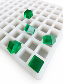 2.625mL square gummy mold with 266 cavities and translucent emerald green square gummies on a clean white background