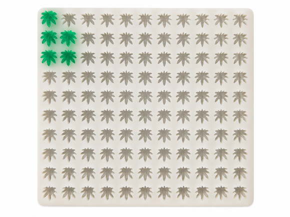 2.73mL cannabis leaf gummy mold with 100 cavities and emerald green leaf gummies on a white background