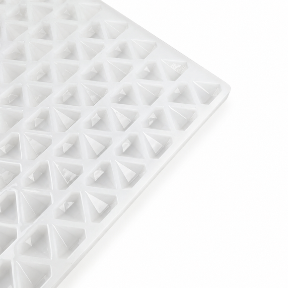 Close-up of an empty 2mL diamond gummy mold with 179 cavities on a white background