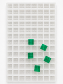 7.5mL 10-piece square breaker gummy mold with 104 cavities and emerald green segmented gummies