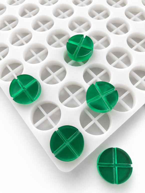 7mL 4-piece disc breaker gummy mold with 70 round segmented cavities and emerald green gummies