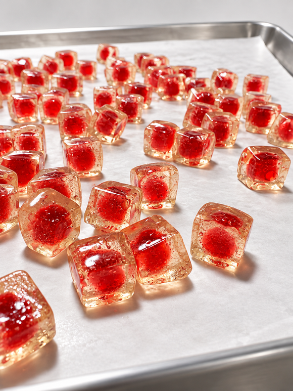 Red center-filled gummies produced with a dual-hopper commercial gummy depositor