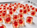 Close-up of red center-filled gummies for dual-hopper commercial gummy depositing
